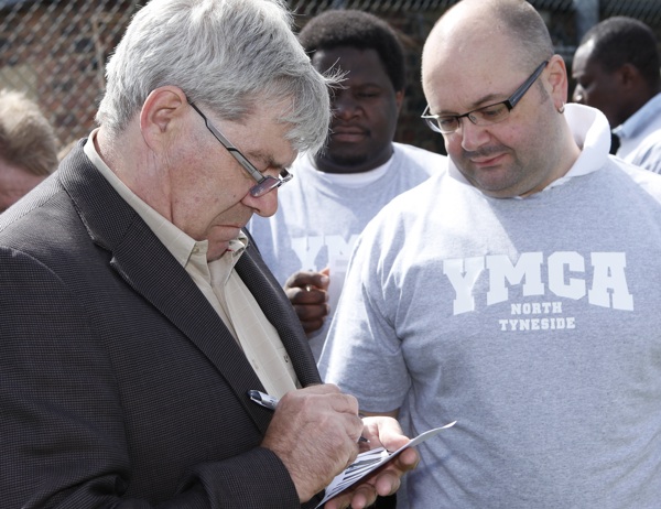 Supermac signs autographs